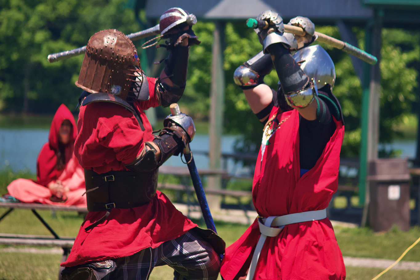 Jack The Pirate and Sir Maneke throw powerful shots against each other simultaneously in a melee battle