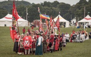 The Ealdormerian populace, headed by Meister Dietrich von Sachsen in a procession at Pennsic.