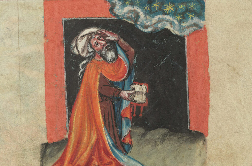 A man in red robes and a turban leans back to view the heavens. He holds an open book in his right hand.